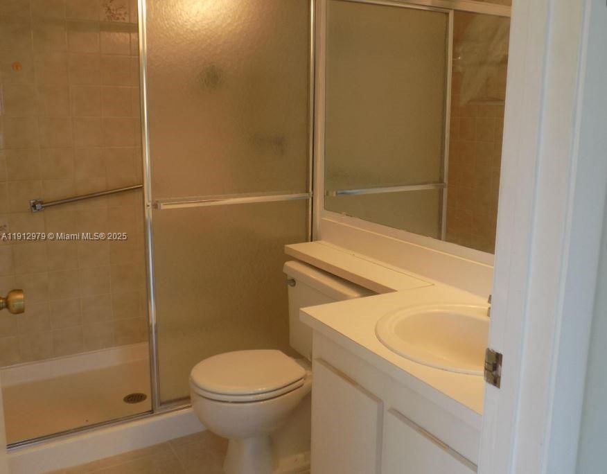 824 Sky Pine Way, Unit A1 West Palm Beach, FL 33415 - Photo 7 of 9 a bathroom with a sink and toilet