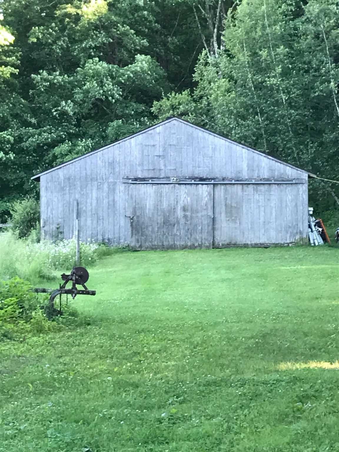 86 Wendover Road Stanford, NY 12581 - Photo 33 of 38 a backyard of a house with plants and a wooden fence