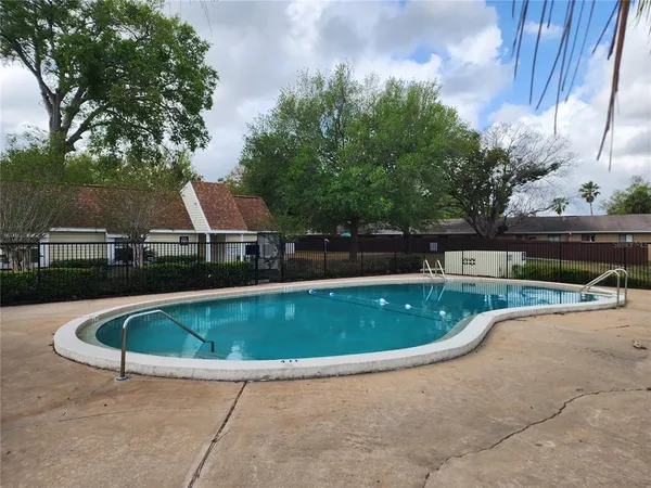 a view of swimming pool with seating space