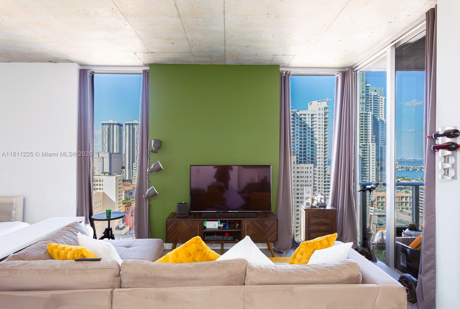 151 Southeast 1st Street, Unit 2204 Miami, FL 33131 - Photo 3 of 34 a living room with furniture pool table and a flat screen tv