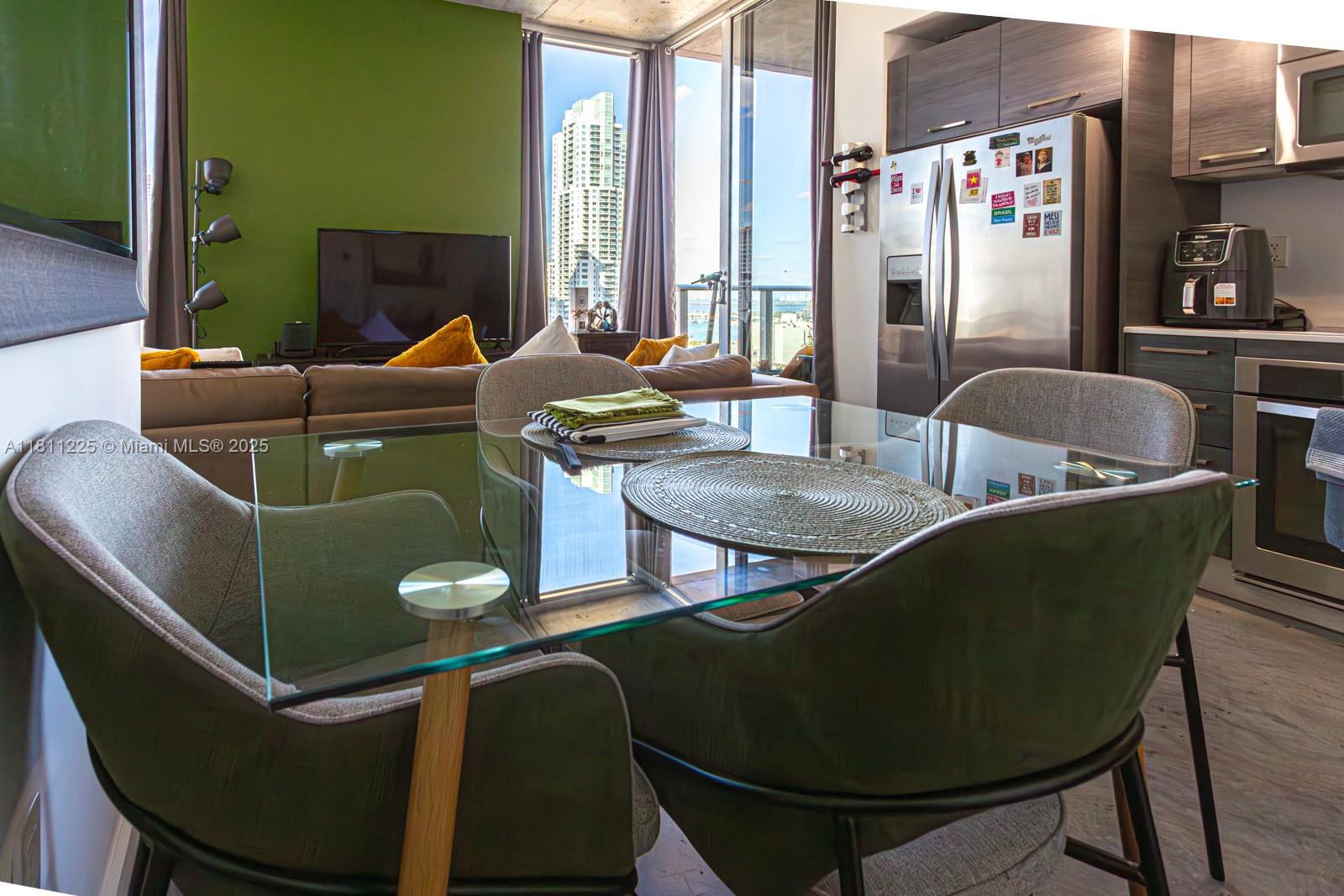 151 Southeast 1st Street, Unit 2204 Miami, FL 33131 - Photo 8 of 34 a living room with furniture and a window