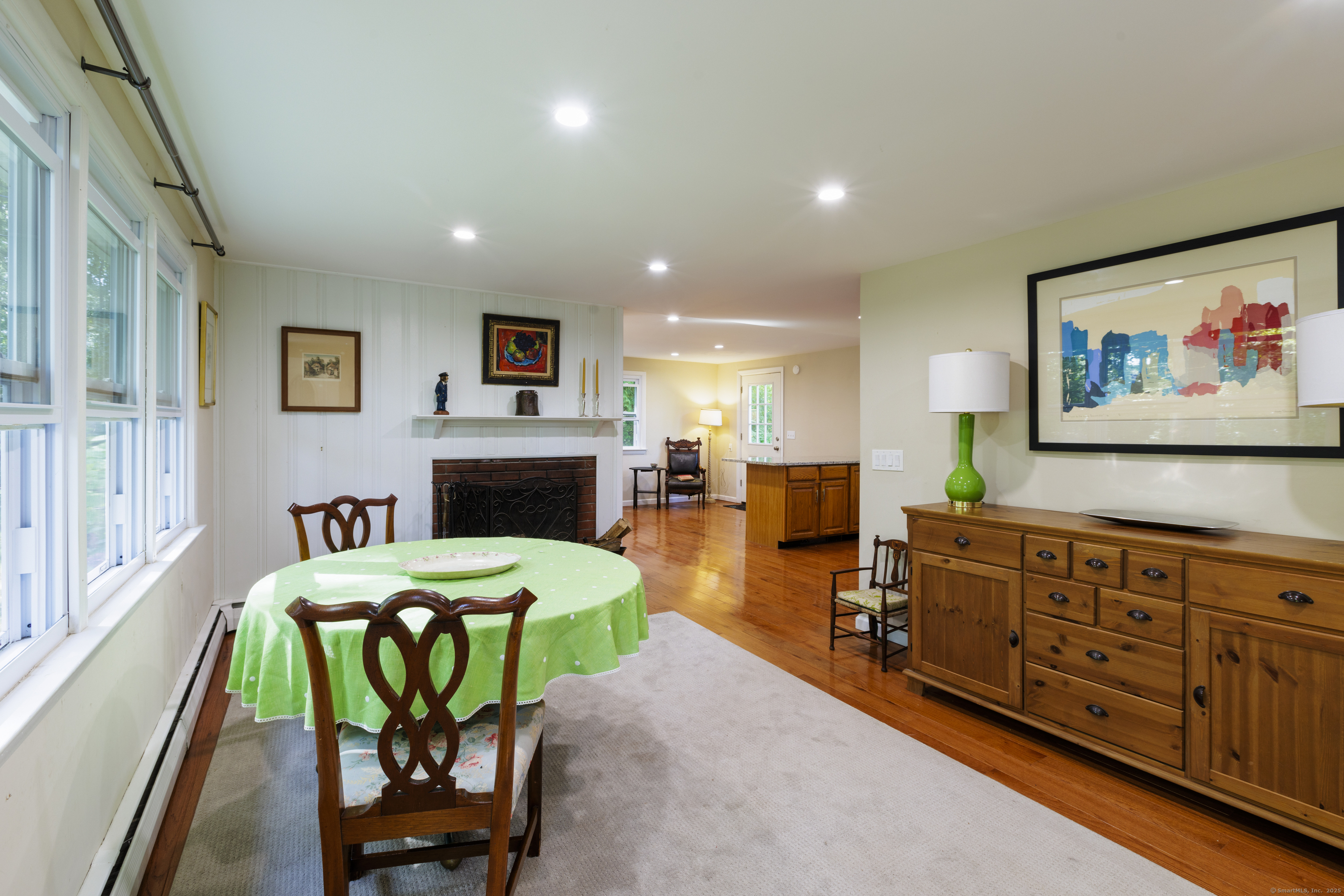 239 A Rockledge Road Lyme, CT 06371 - Photo 7 of 30 a living room with furniture a flat screen tv and a fireplace