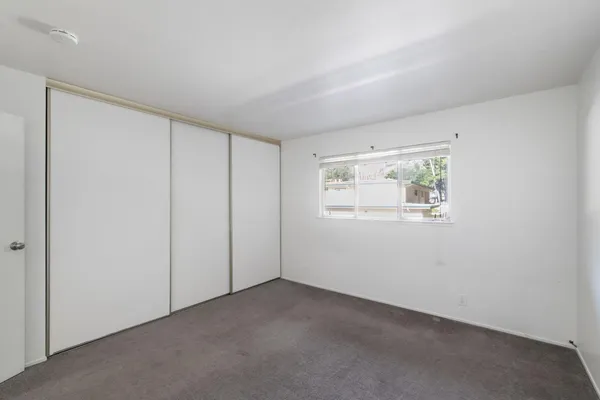 an empty room with a empty space and window