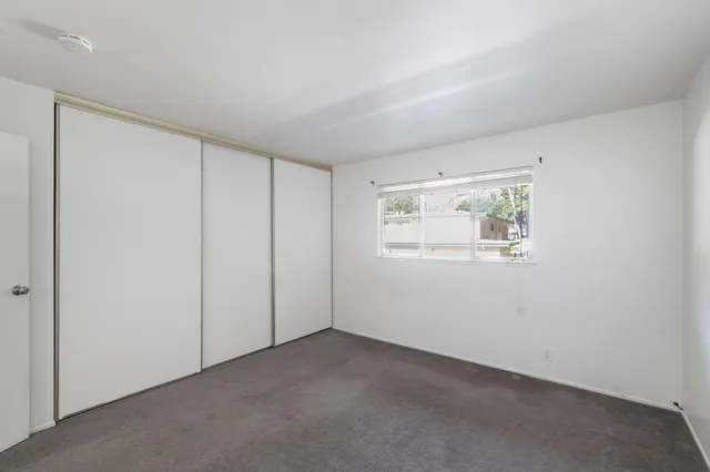 an empty room with a empty space and window