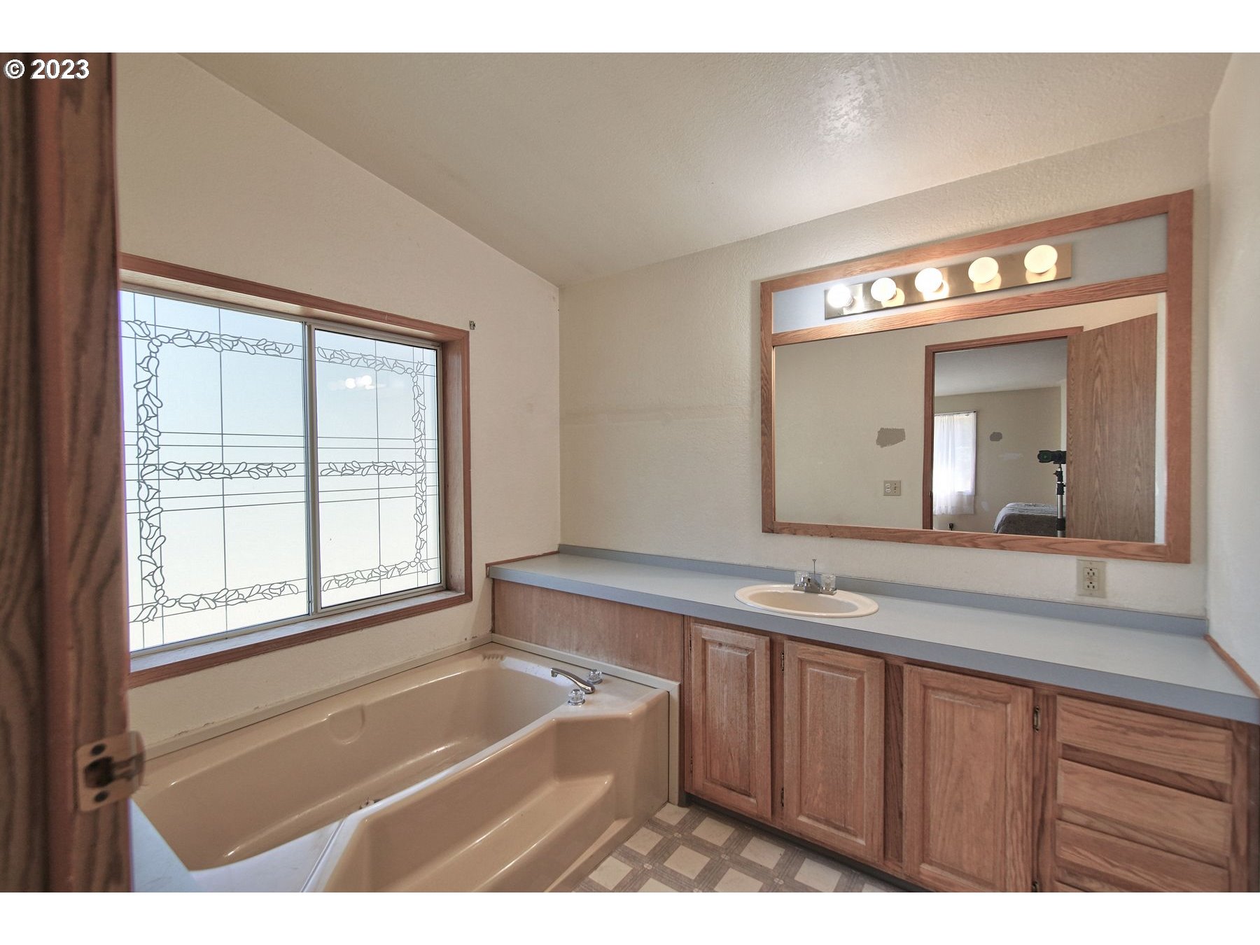 71994 Beaver Springs Road Rainier, OR 97048 - Photo 30 of 37 a bathroom with a sink a large mirror and a bathtub