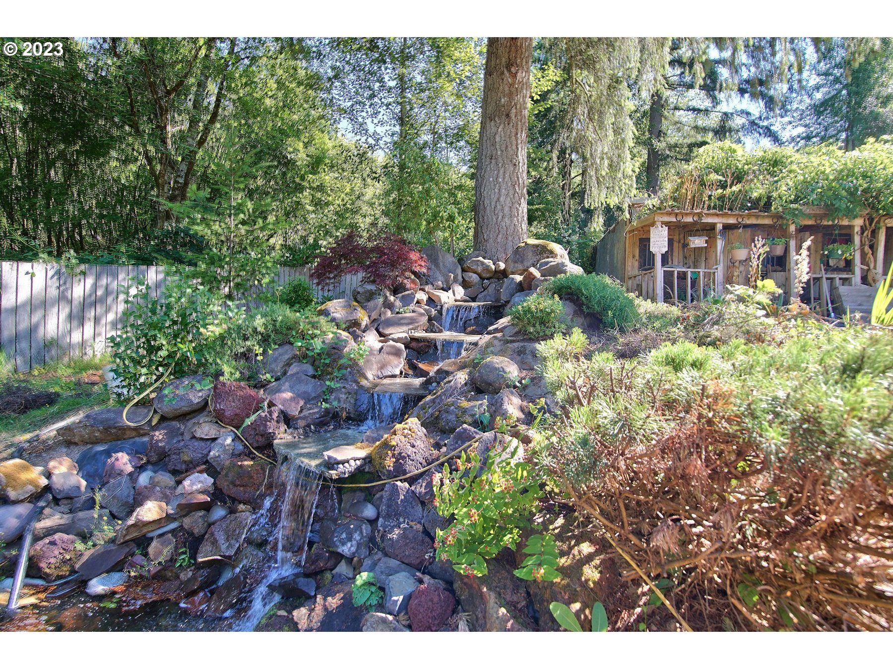 71994 Beaver Springs Road Rainier, OR 97048 - Photo 3 of 37 a view of a house with a flower garden