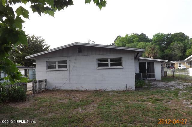 7503 Strato Road Jacksonville, FL 32210 - Photo 8 of 8 a house with trees in front of it