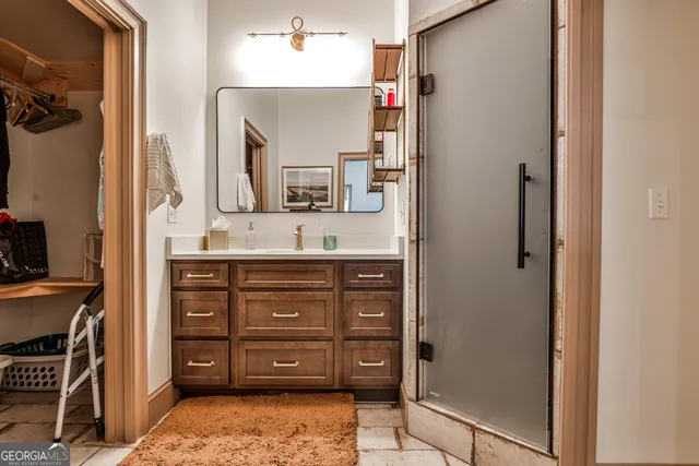 a bathroom with a sink a vanity and a mirror