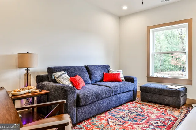a living room with furniture and a window