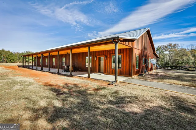 a view of swimming pool with an outdoor seating
