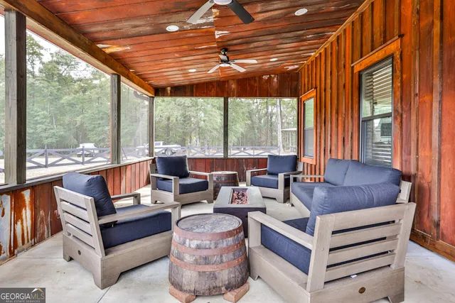 a outdoor living space with patio furniture and garden view