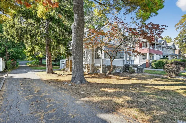 a view of a town with large trees