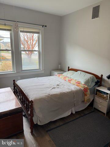 524 Lafayette Street Colonial Beach, VA 22443 - Photo 11 of 20 a bed sitting in a bedroom next to a window