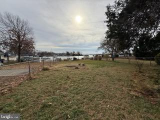 524 Lafayette Street Colonial Beach, VA 22443 - Photo 16 of 20 a view of a lake with houses in the background