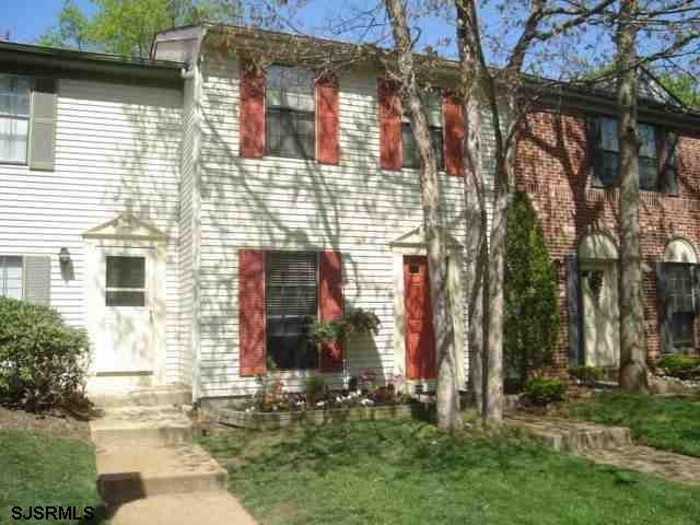 215 Mattix Run, Unit 215 Galloway Township, NJ 08205 - Photo 1 of 1 a brick building with a large windows