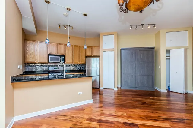 a view of bathroom with a sink and shower