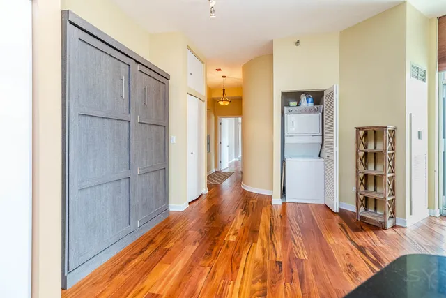 a view of a livingroom with wooden floor