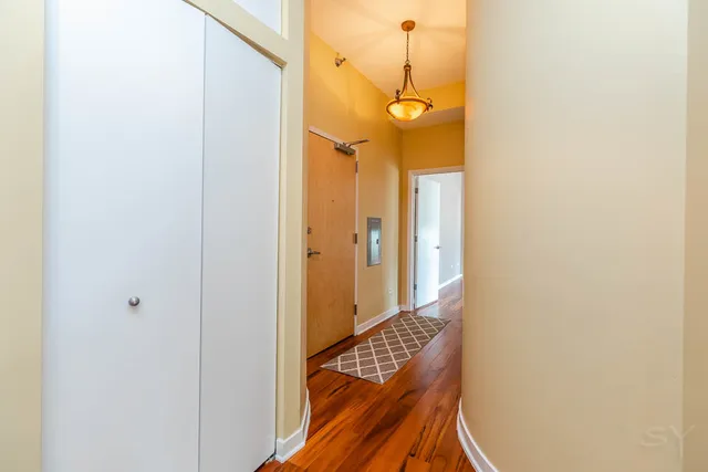 a bathroom with a granite countertop toilet sink and mirror