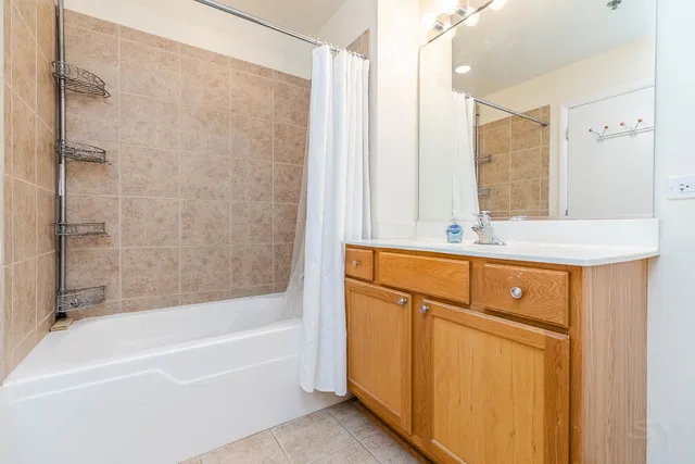 a view of a room with wooden floor and windows