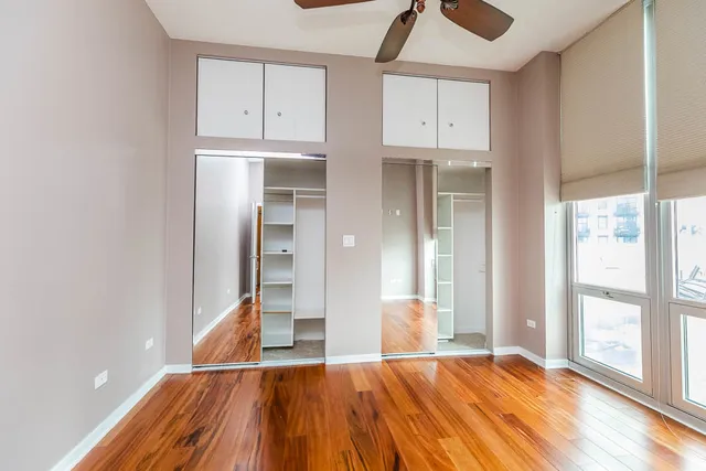 a view of room with window and wooden floor