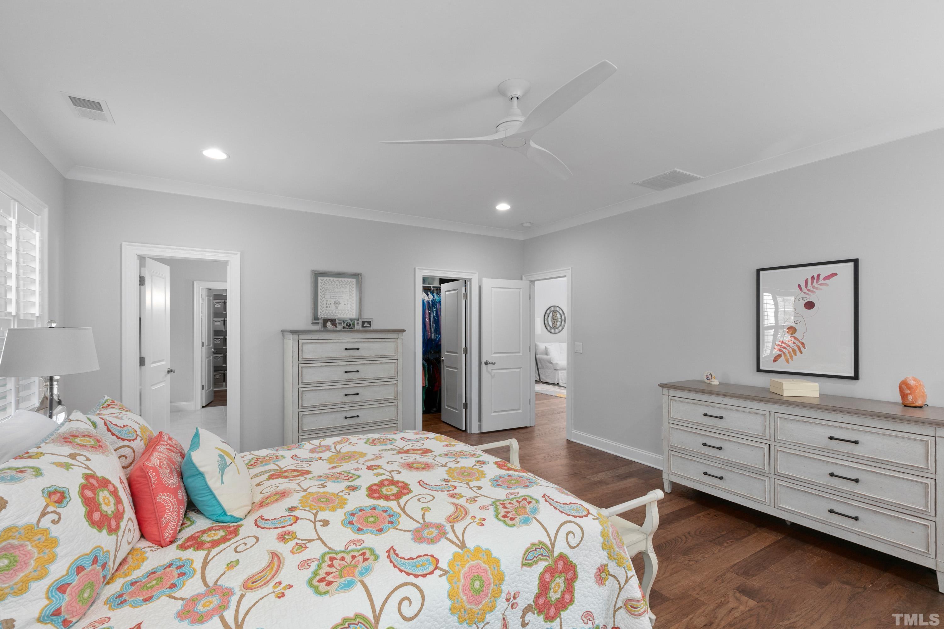 8017 Shree Court Raleigh, NC 27613 - Photo 11 of 30 a bedroom with a bed and a dresser