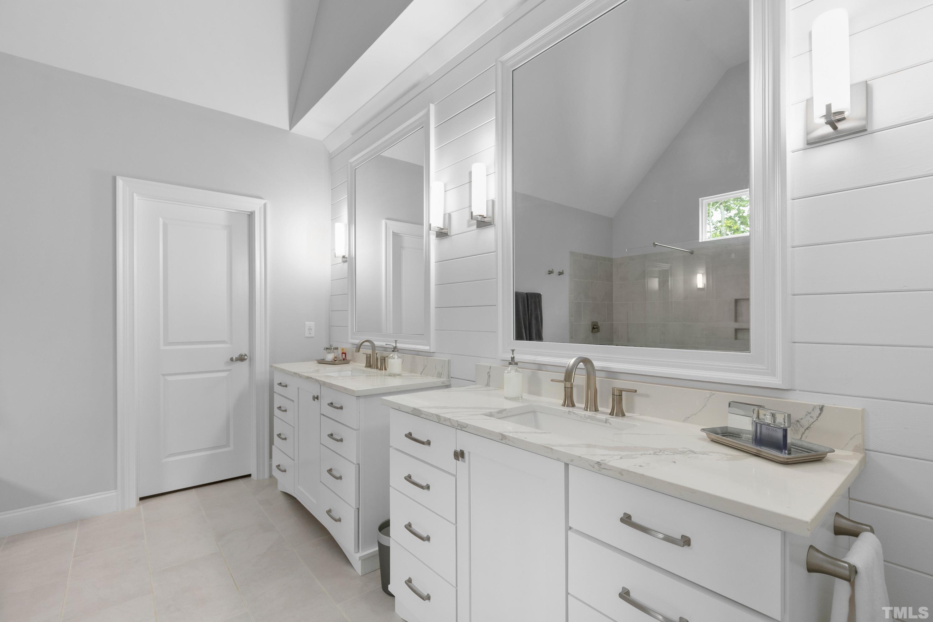 8017 Shree Court Raleigh, NC 27613 - Photo 12 of 30 a bathroom with double sink and a mirror