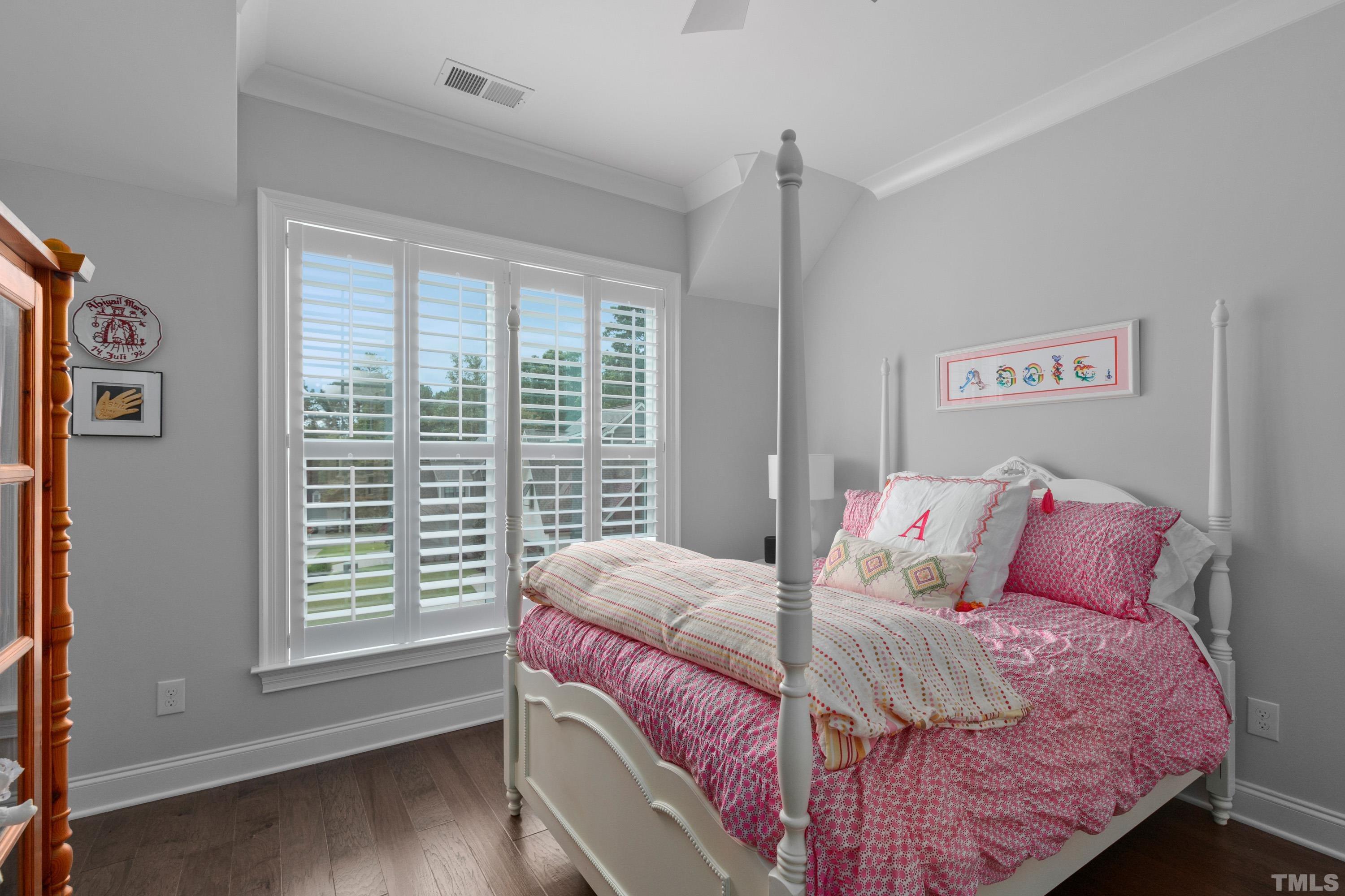 8017 Shree Court Raleigh, NC 27613 - Photo 14 of 30 a bedroom with a bed and a large window