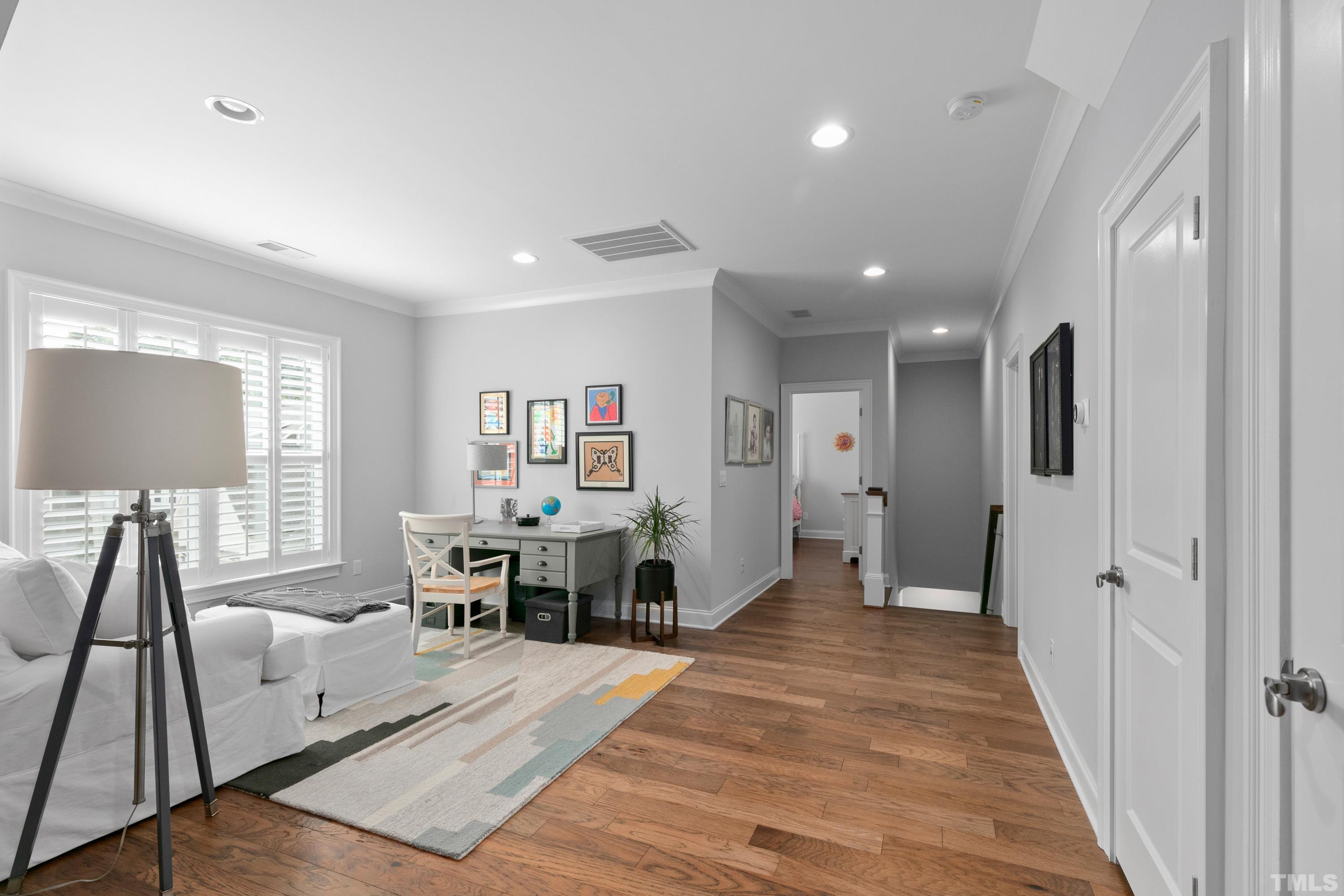 8017 Shree Court Raleigh, NC 27613 - Photo 16 of 30 a view of a living room and dining room