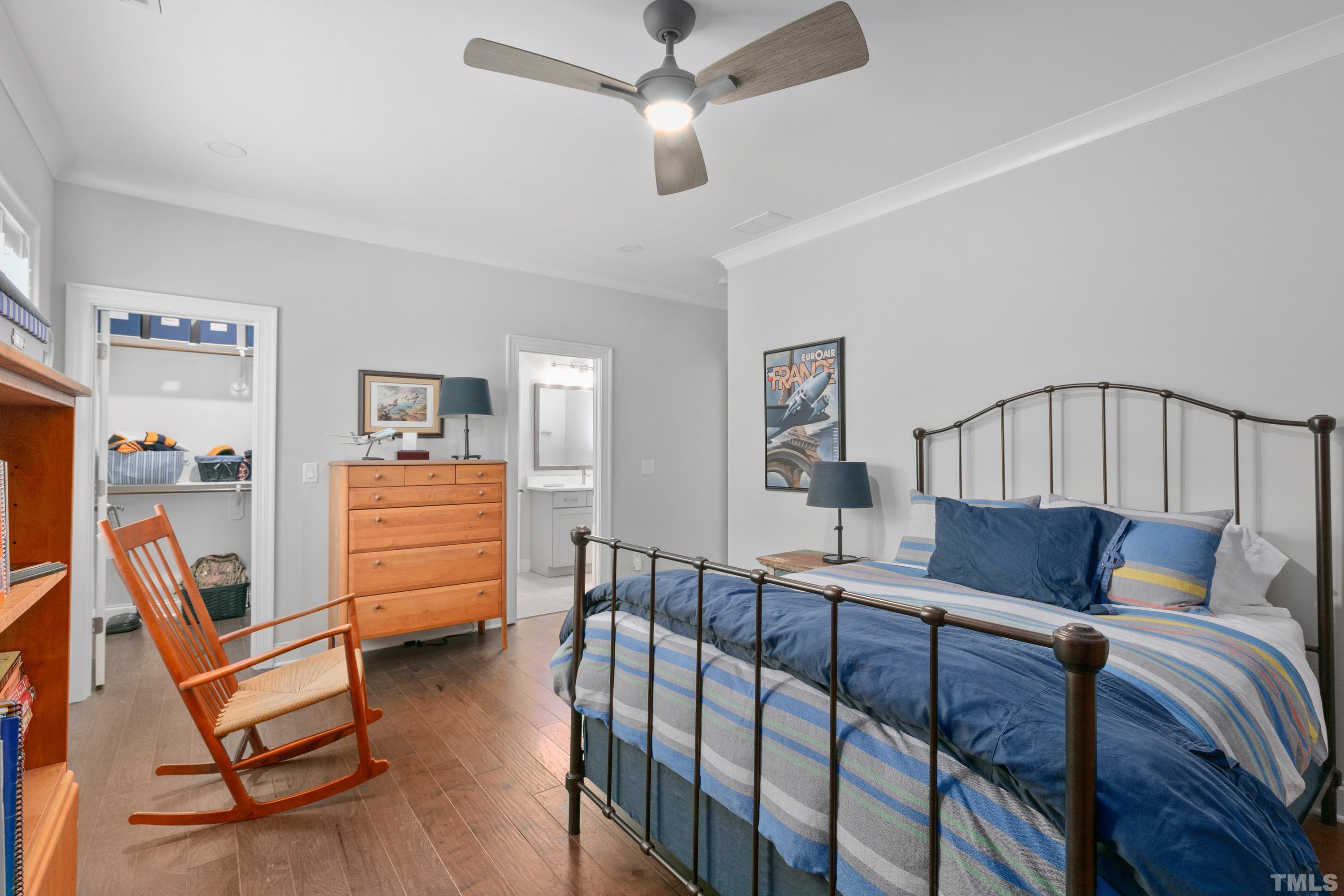 8017 Shree Court Raleigh, NC 27613 - Photo 18 of 30 a bedroom with furniture and wooden floor