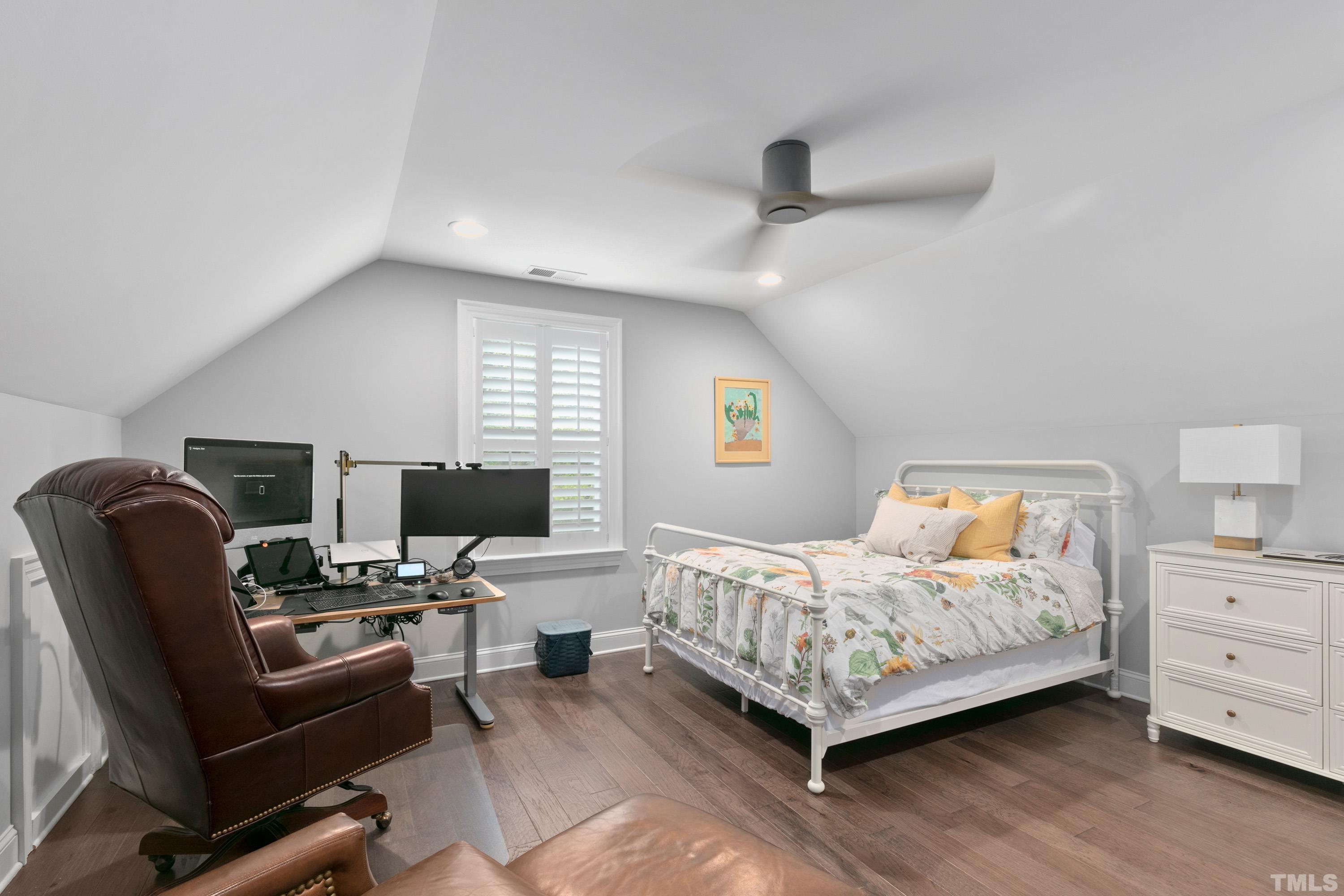 8017 Shree Court Raleigh, NC 27613 - Photo 20 of 30 a bedroom with furniture and a window