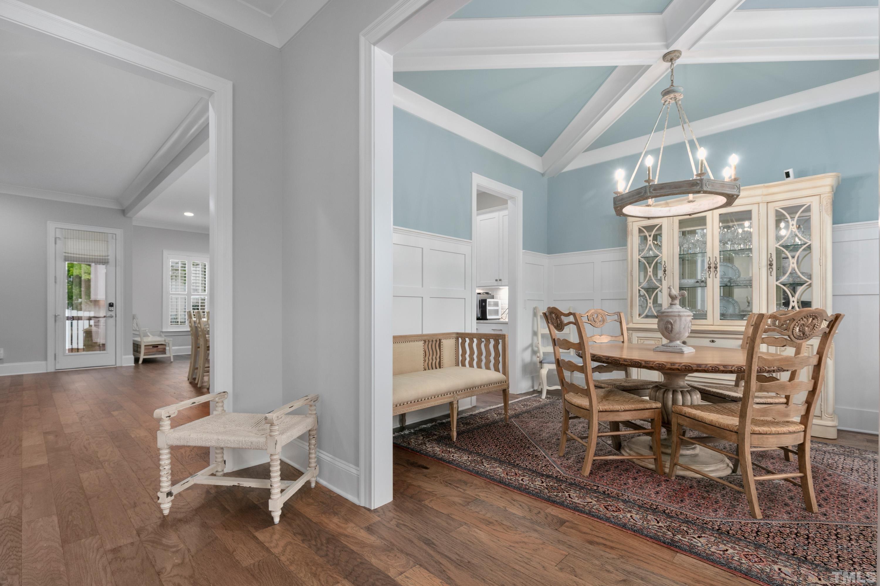 8017 Shree Court Raleigh, NC 27613 - Photo 3 of 30 a view of a dining room with furniture and wooden floor
