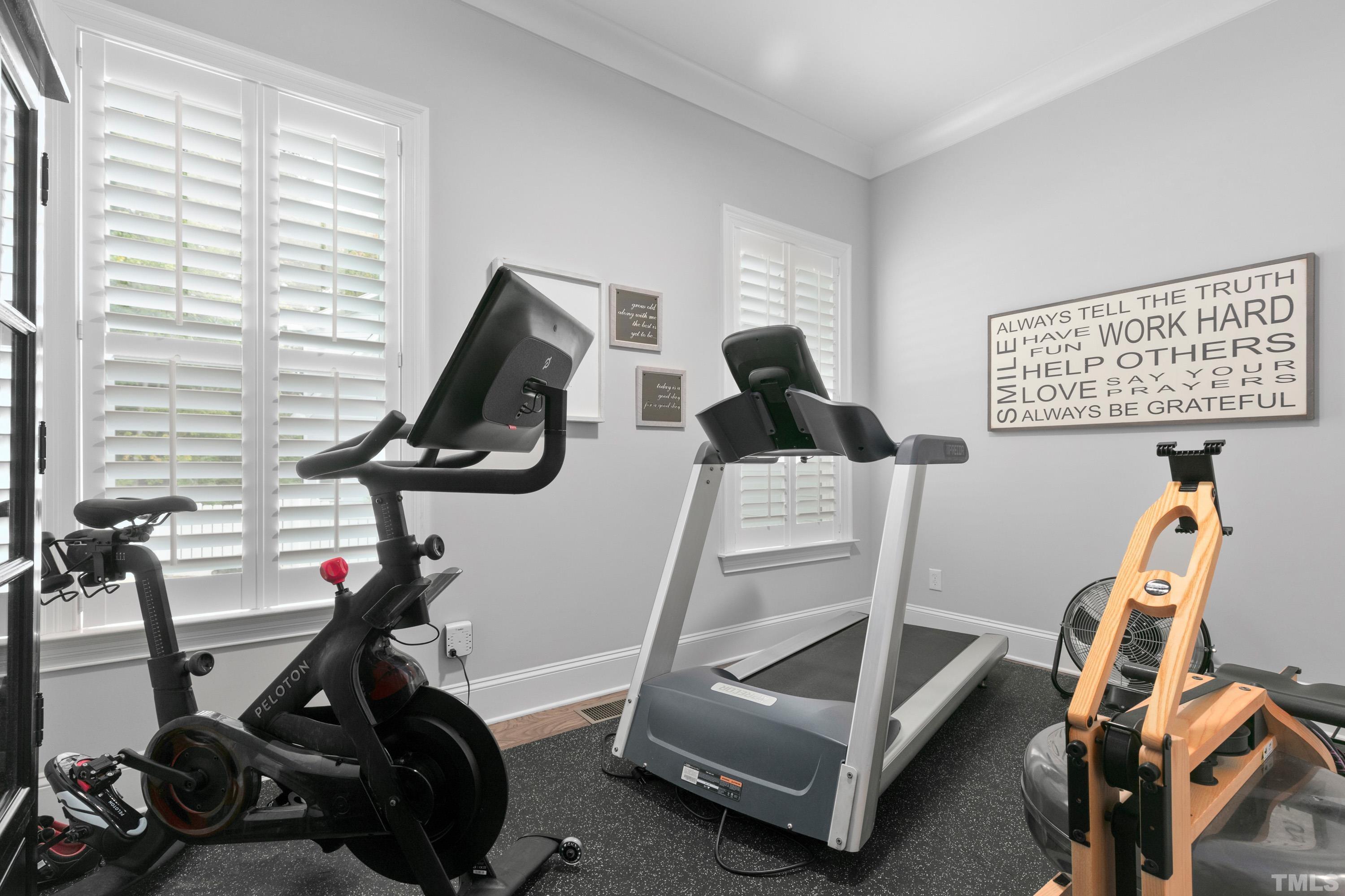 8017 Shree Court Raleigh, NC 27613 - Photo 22 of 30 a view of a room with gym equipment