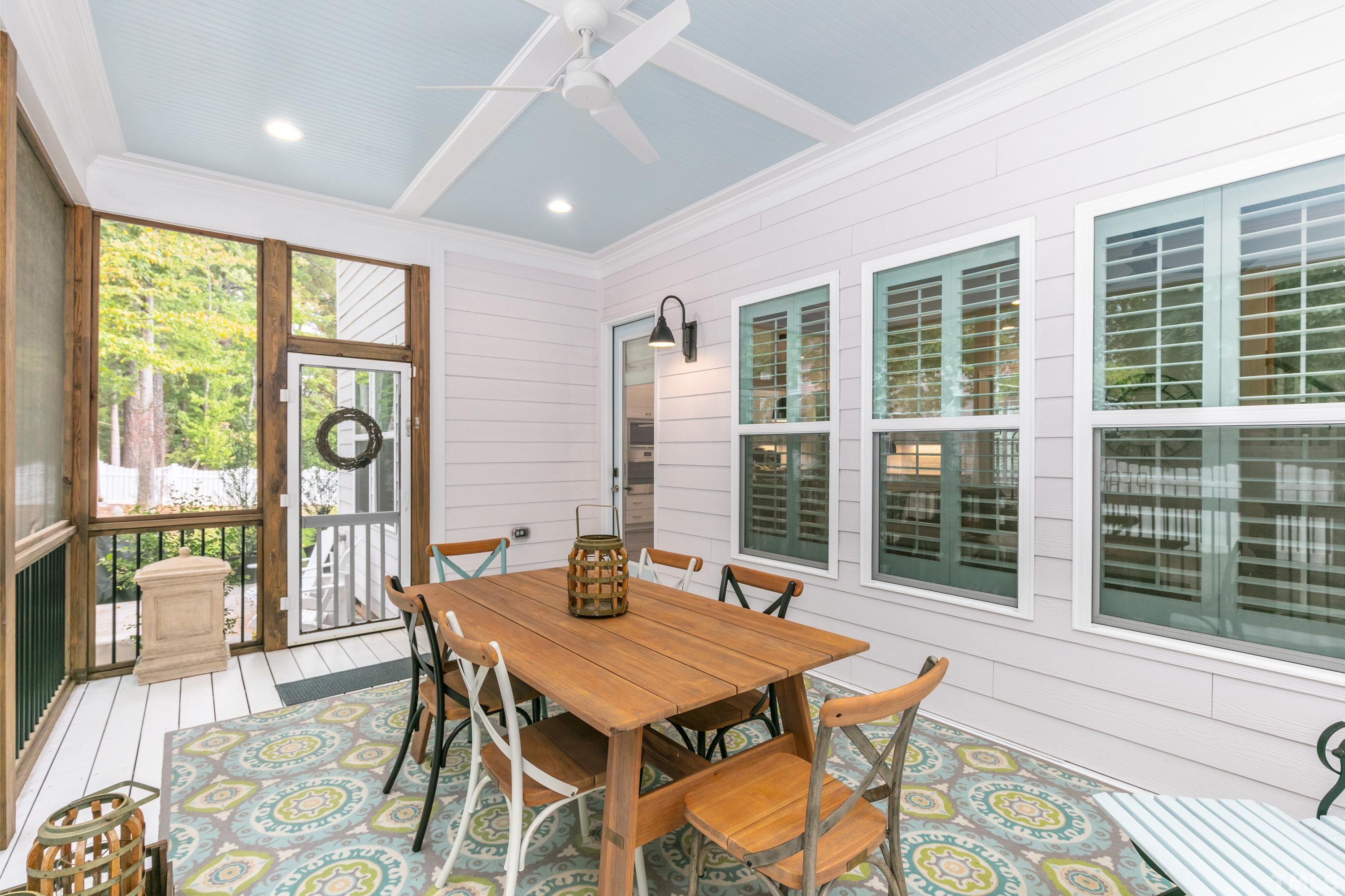 8017 Shree Court Raleigh, NC 27613 - Photo 24 of 30 a dining room with furniture a chandelier and wooden floor