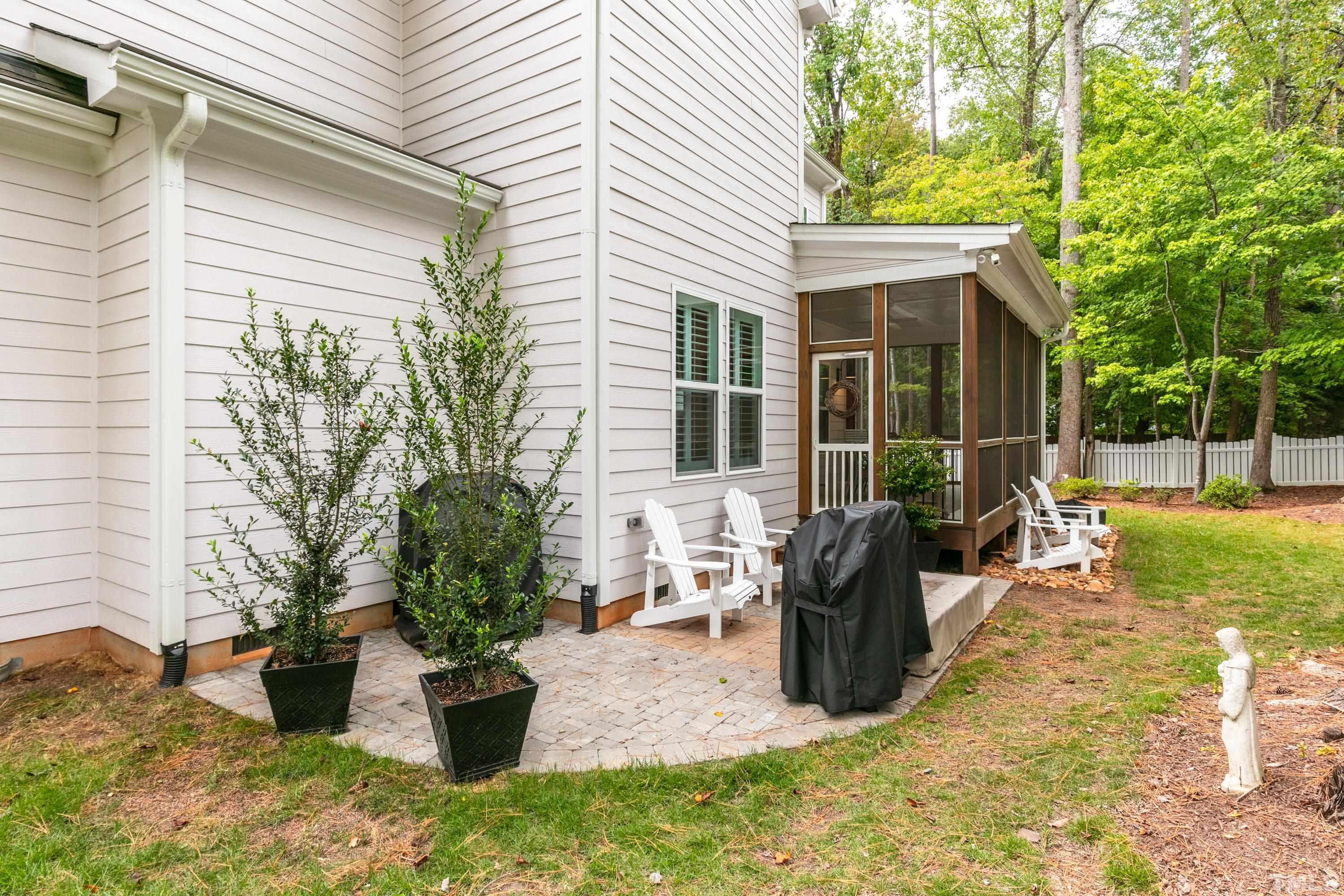 8017 Shree Court Raleigh, NC 27613 - Photo 26 of 30 a view of a house with backyard and sitting area