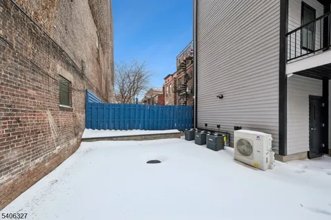 a view of backyard and deck