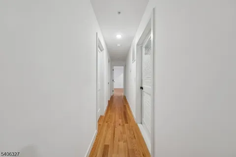 a view of a hallway with a white door