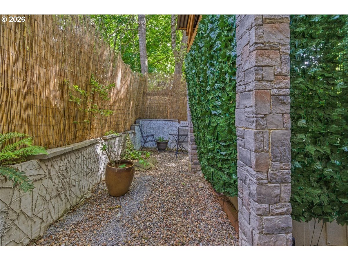 19240 Southwest Rosedale Court Beaverton, OR 97007 - Photo 31 of 38 a backyard of a house with table and chairs