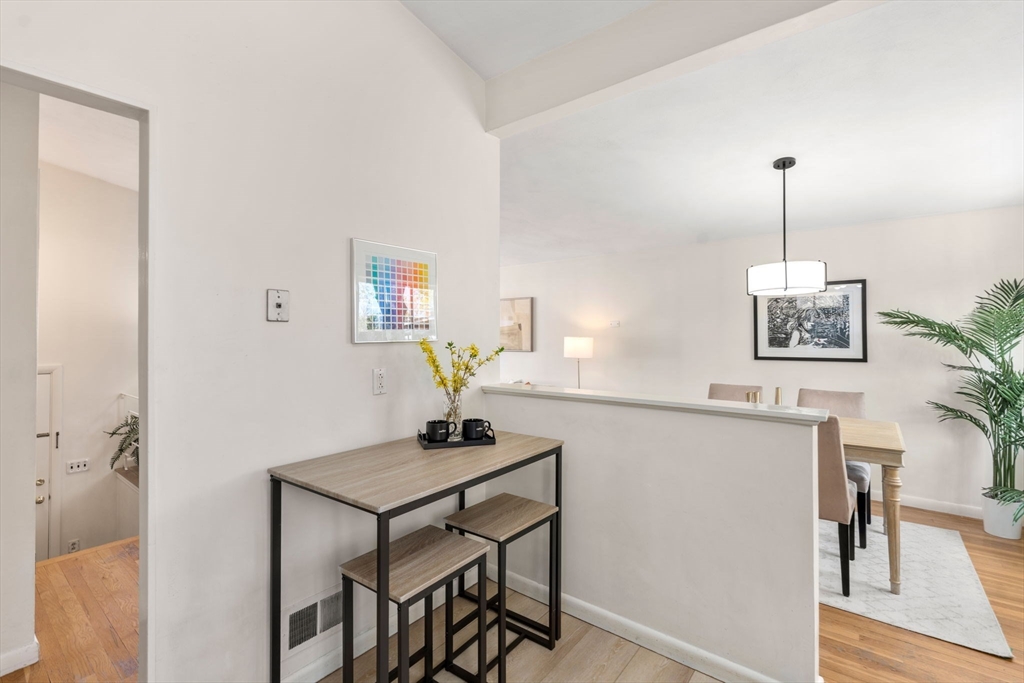 14 Fuller Avenue Newton, MA 02465 - Photo 11 of 27 a view of a workspace with furniture and wooden floor