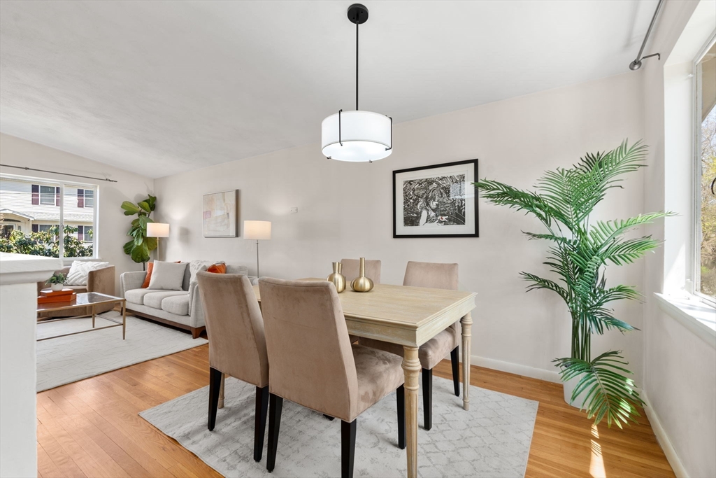 14 Fuller Avenue Newton, MA 02465 - Photo 13 of 27 a dining room with furniture potted plants and wooden floor
