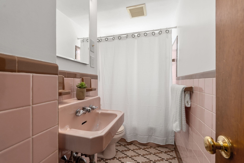 14 Fuller Avenue Newton, MA 02465 - Photo 17 of 27 a bathroom with a sink toilet and shower