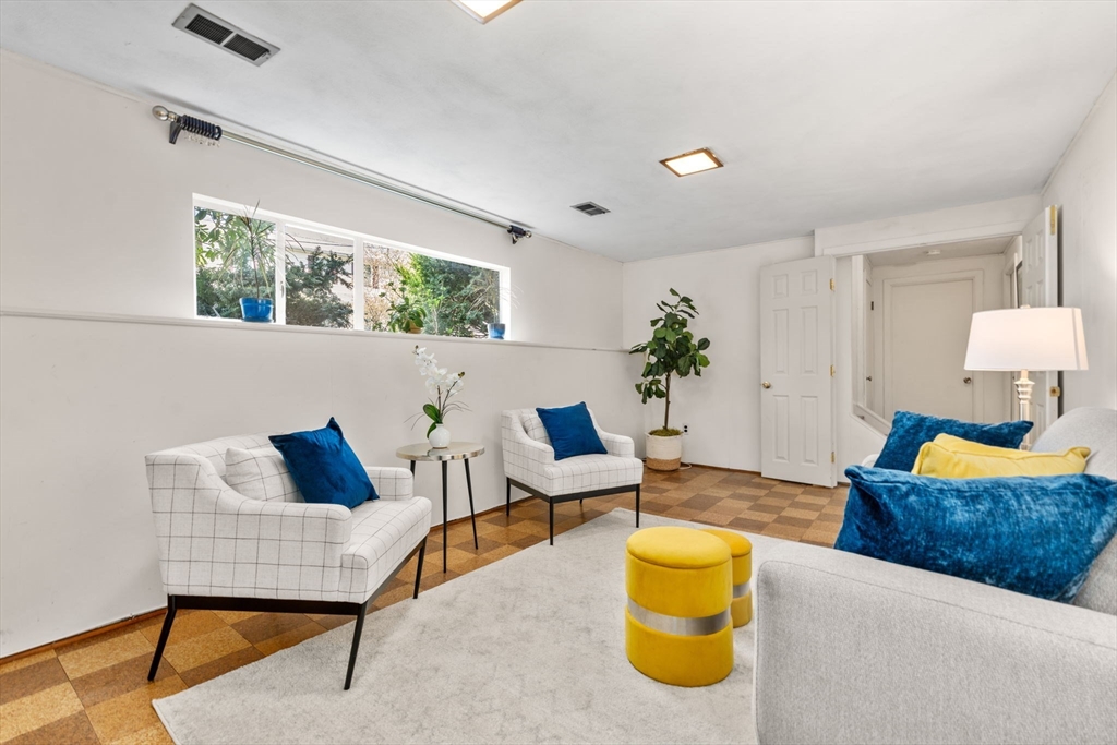 14 Fuller Avenue Newton, MA 02465 - Photo 21 of 27 a living room with furniture and a window