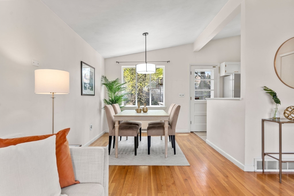 14 Fuller Avenue Newton, MA 02465 - Photo 6 of 27 a dining room with furniture a rug a potted plant and wooden floor