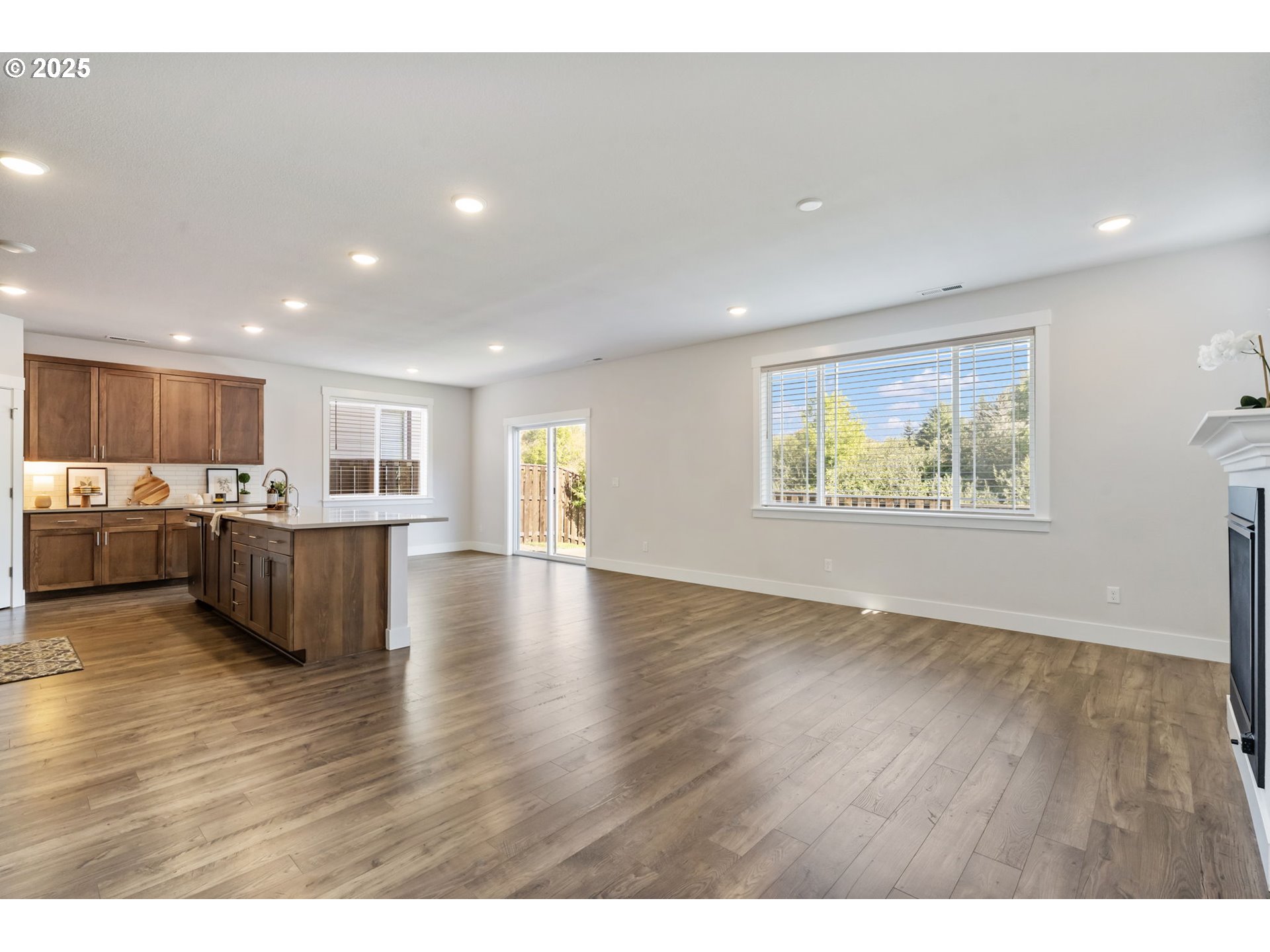 18246 Southwest Silvertip Street Beaverton, OR 97007 - Photo 12 of 46 a view of kitchen and kitchen with furniture wooden floor