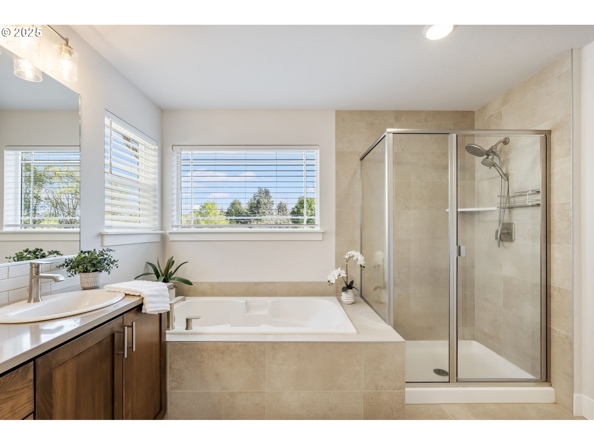 18246 Southwest Silvertip Street Beaverton, OR 97007 - Photo 26 of 46 a bathroom with a sink mirror toilet and bathtub