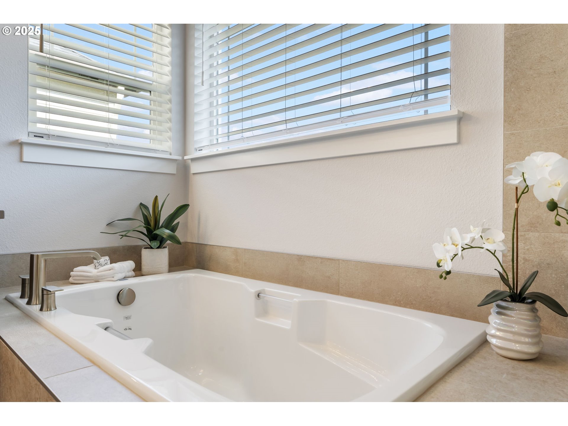 18246 Southwest Silvertip Street Beaverton, OR 97007 - Photo 27 of 46 a bathroom with a bathtub and a sink