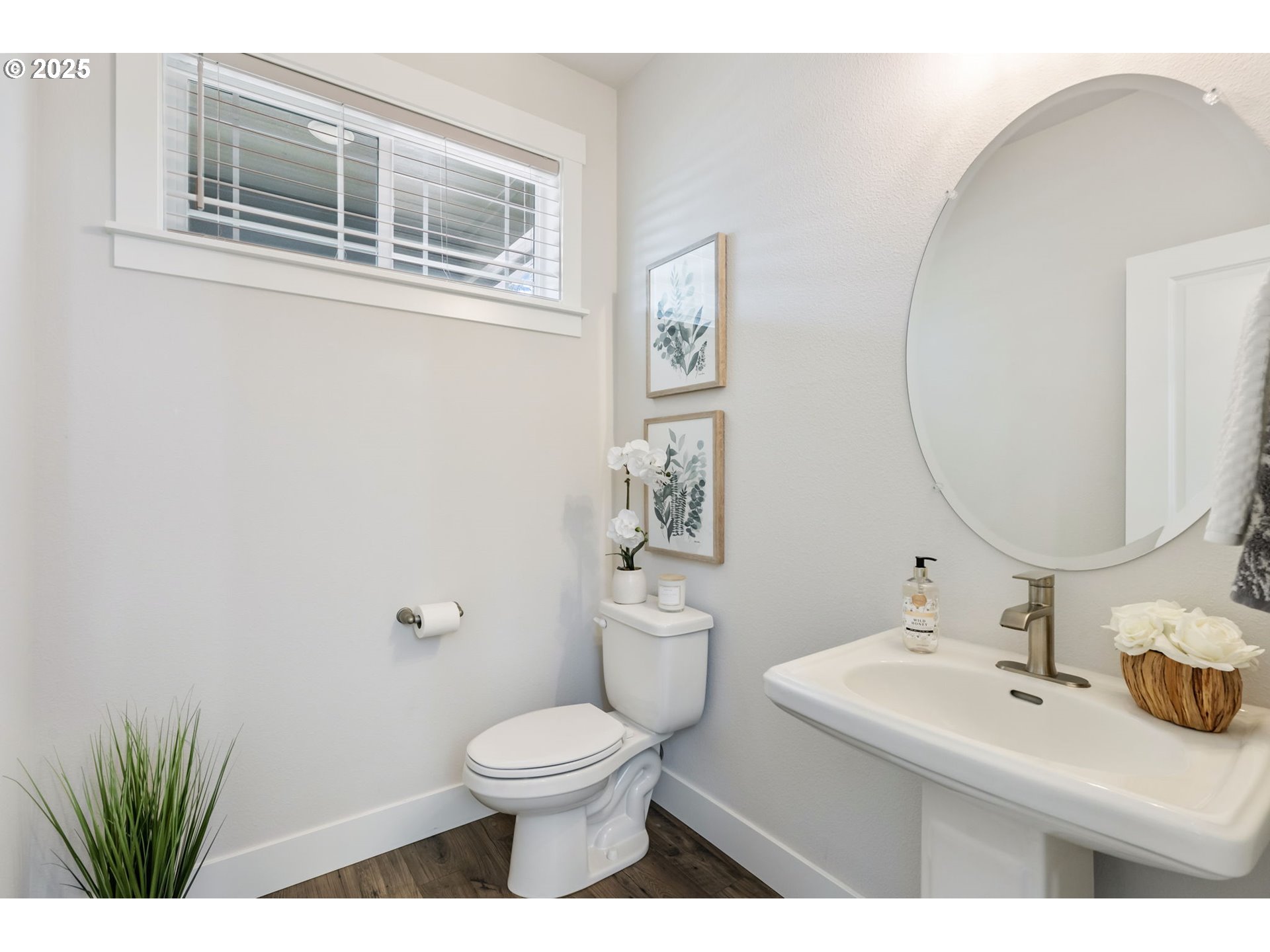 18246 Southwest Silvertip Street Beaverton, OR 97007 - Photo 29 of 46 a bathroom with a sink a toilet and a mirror