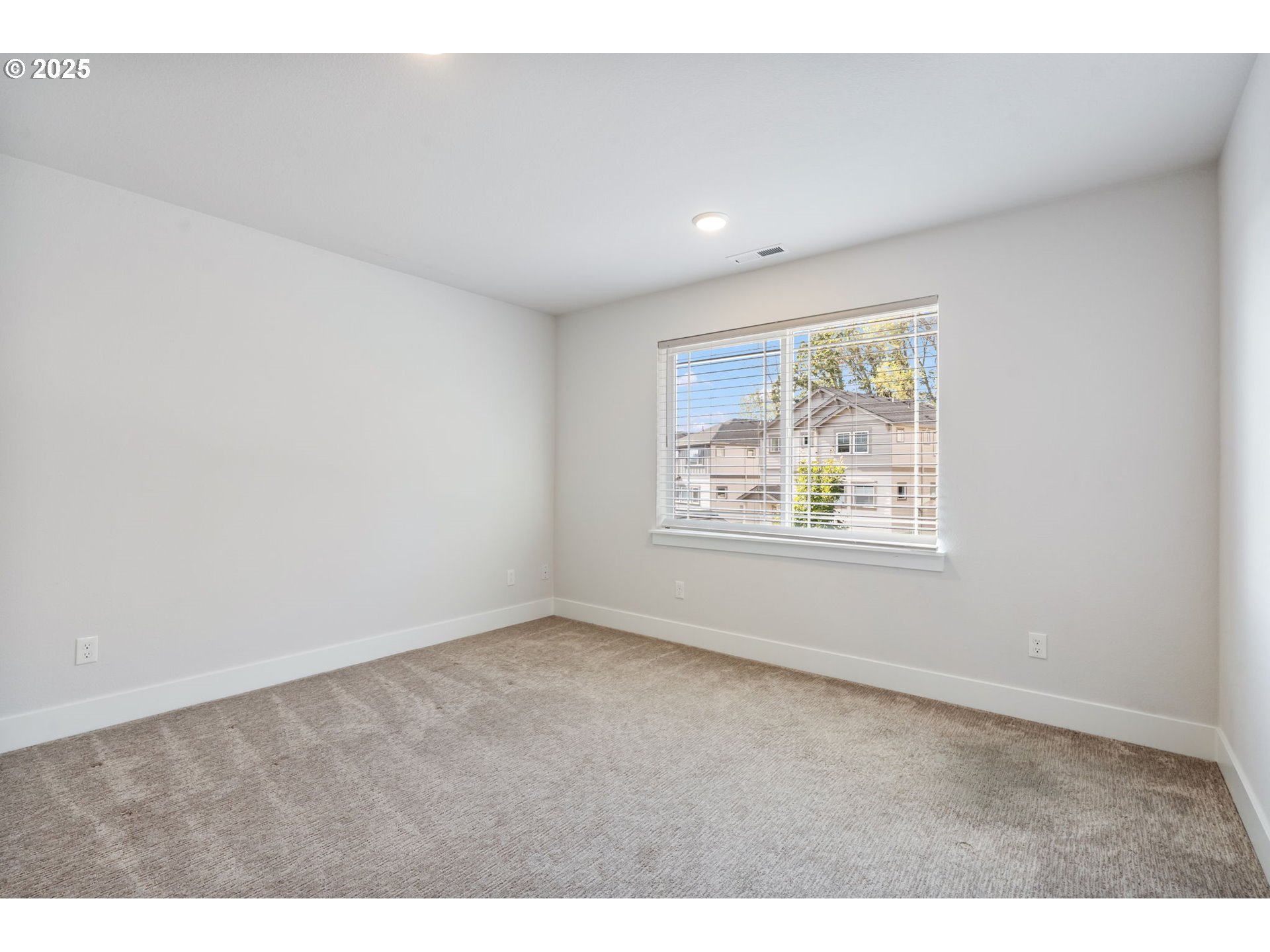 18246 Southwest Silvertip Street Beaverton, OR 97007 - Photo 35 of 46 a view of an empty room with a window