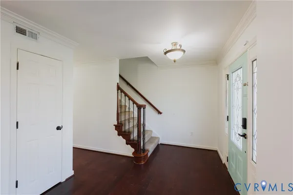 a kitchen with stainless steel appliances granite countertop a refrigerator and a stove