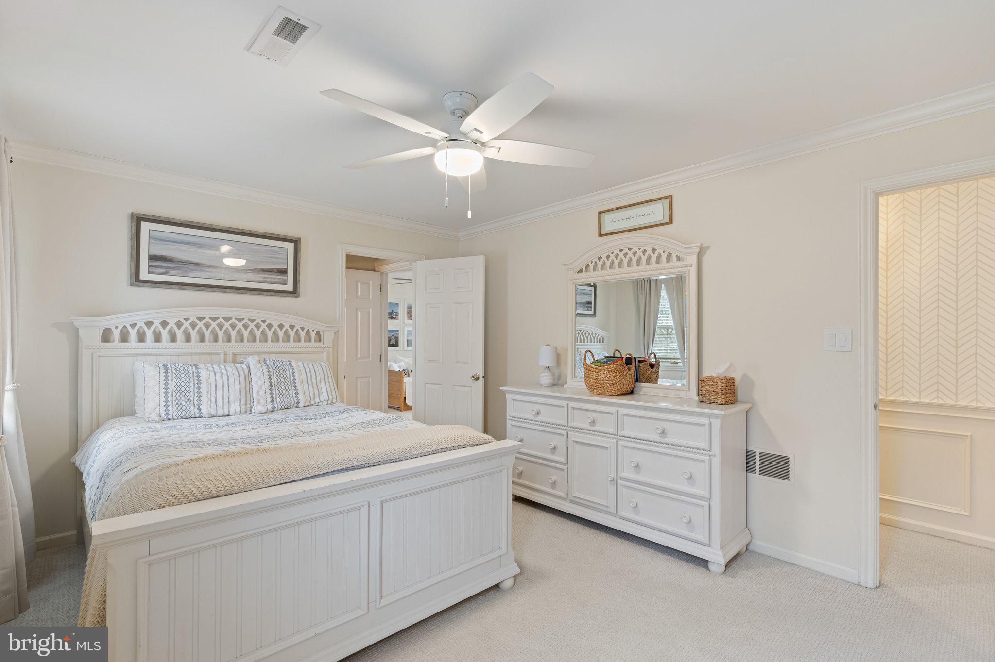 1323 Gypsy Hill Road Lower Gwynedd, PA 19002 - Photo 36 of 51 a bedroom with a large bed and a chandelier