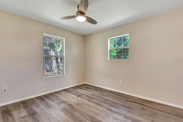 a view of empty room with windows